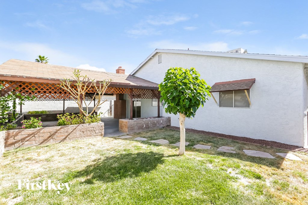 a house with a yard and a tree