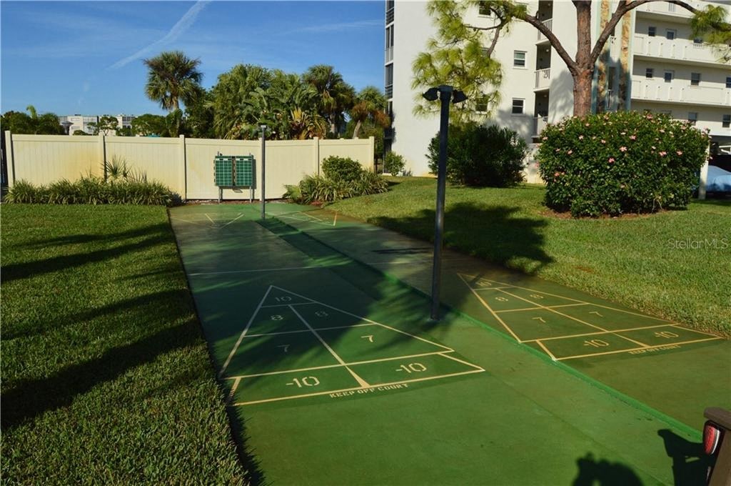 a game of hopscotch on a tennis court in a park