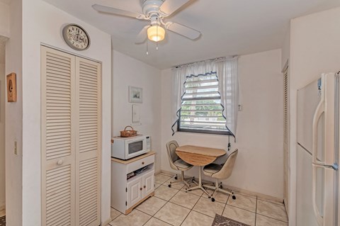 a dining room with a table and a microwave