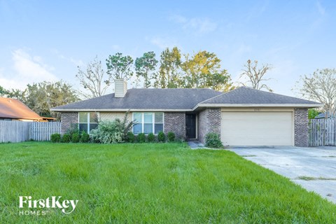 A house with a garage is for sale by FirstKey Homes.