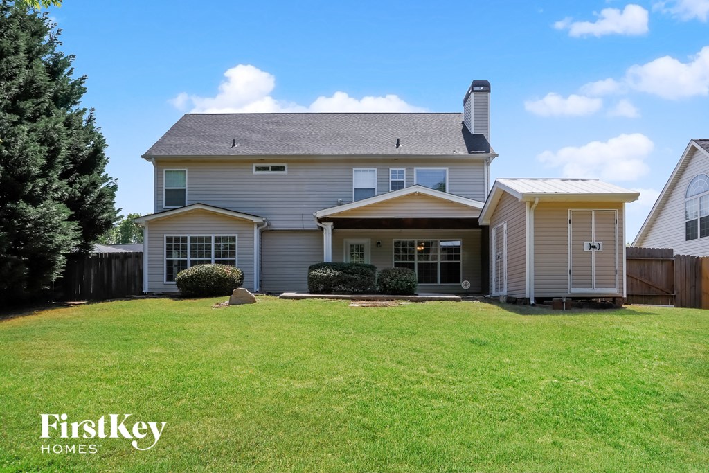 a house with a lawn in front of it