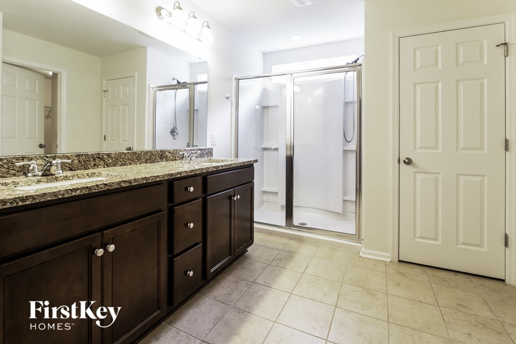 a bathroom with a sink and a shower