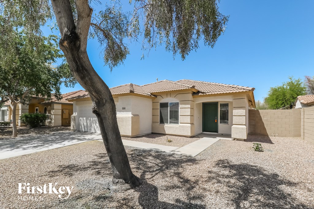 A house with a tree in front of it.