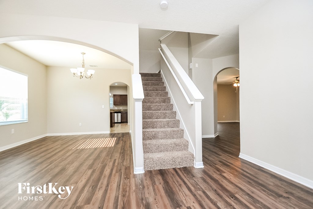 the living room and staircase to the 2nd and 3rd floors