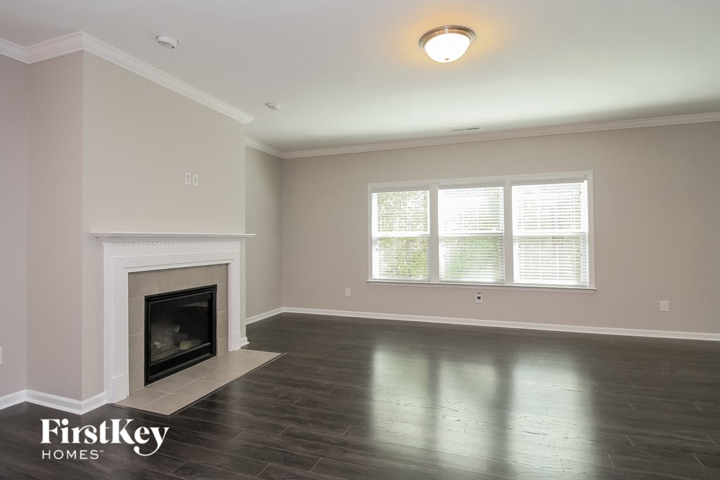 the living room of a house with a fireplace