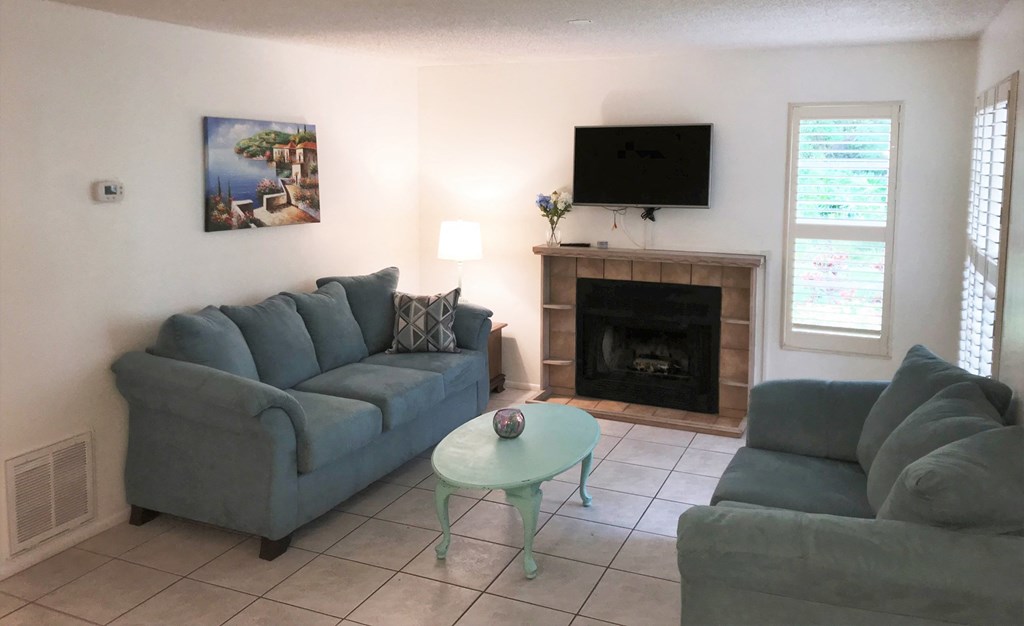 a living room with couches and a table