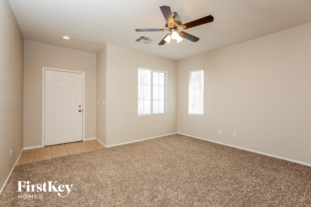 the master bedroom is spacious and has a ceiling fan