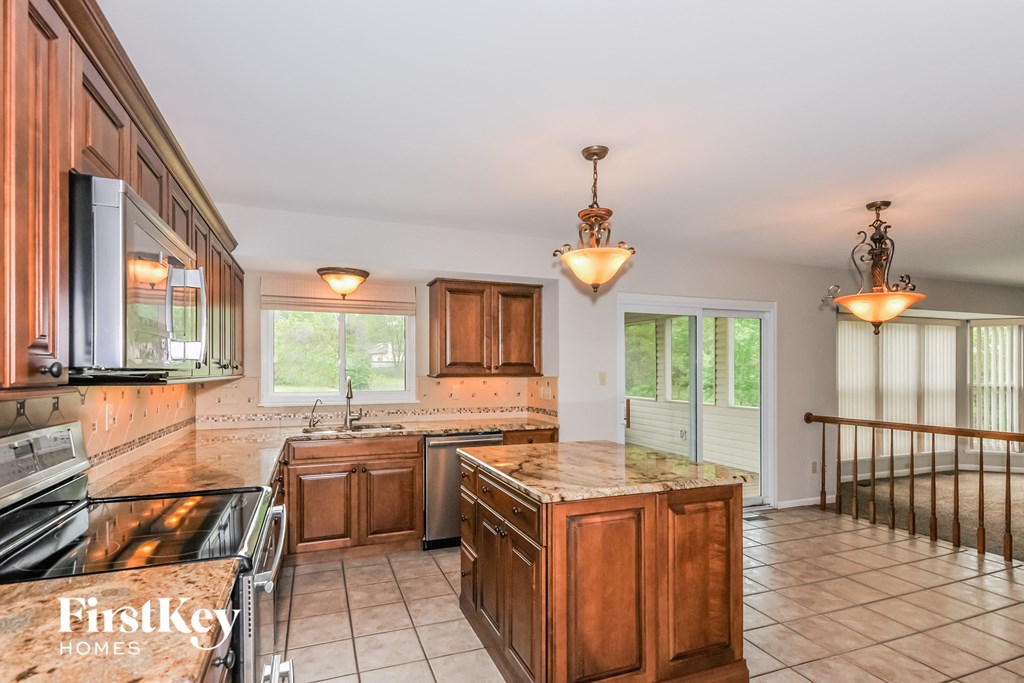 a kitchen with wooden cabinets and a counter top