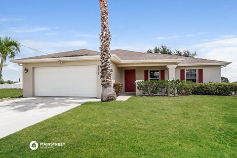 a house with a palm tree in front of it