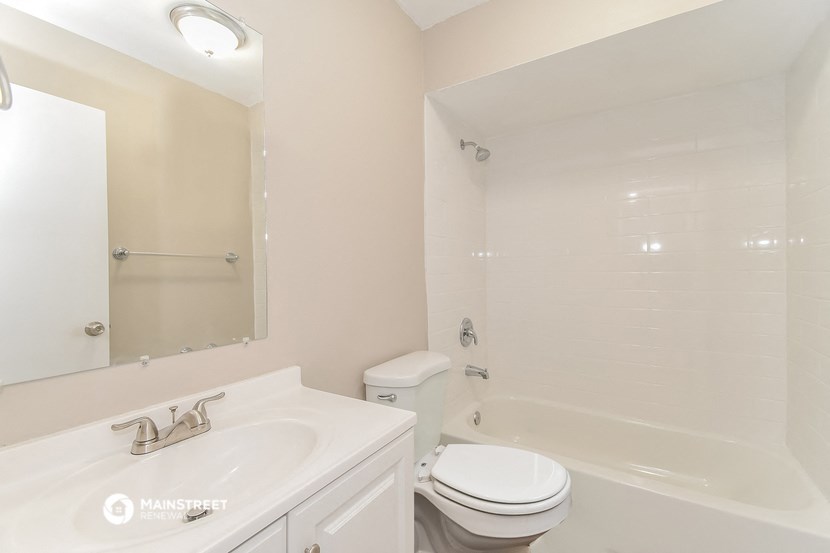 a bathroom with a sink toilet and a shower