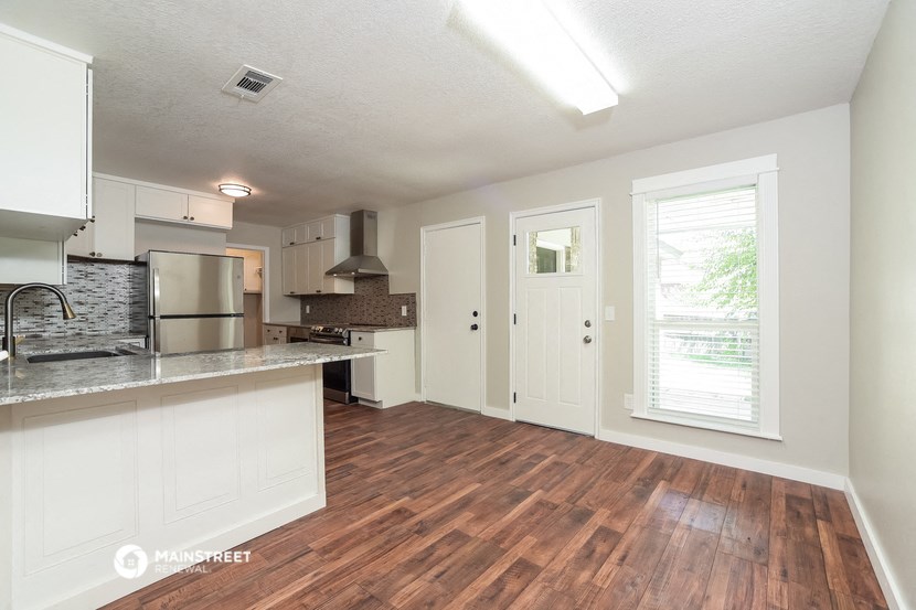 the kitchen and living room of an open floor plan