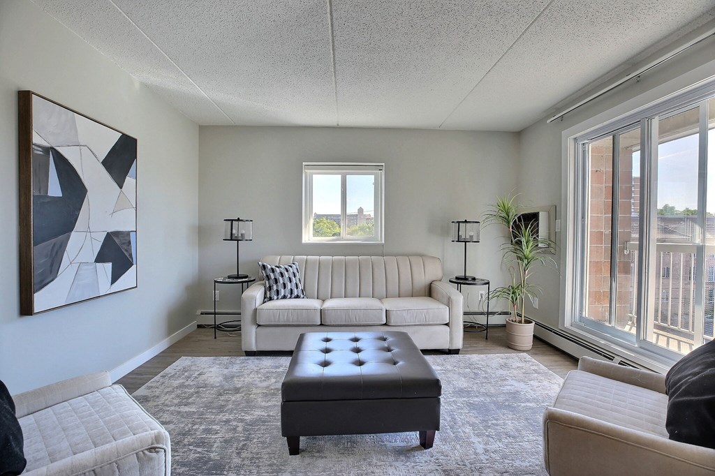 the living room of an apartment with a couch and a