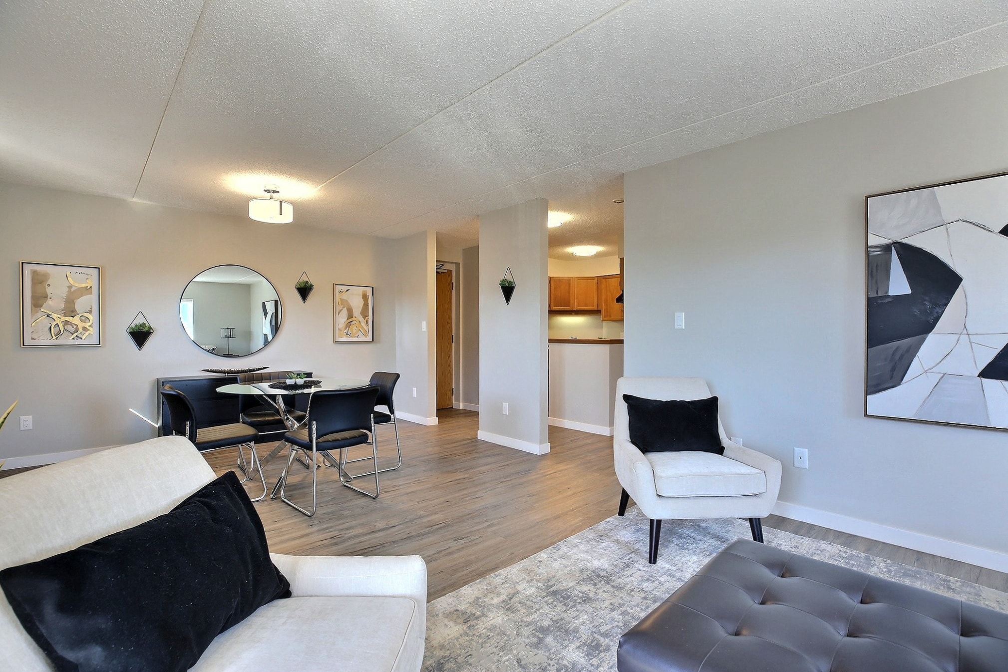 our apartments have a living room and dining room with a table and chairs