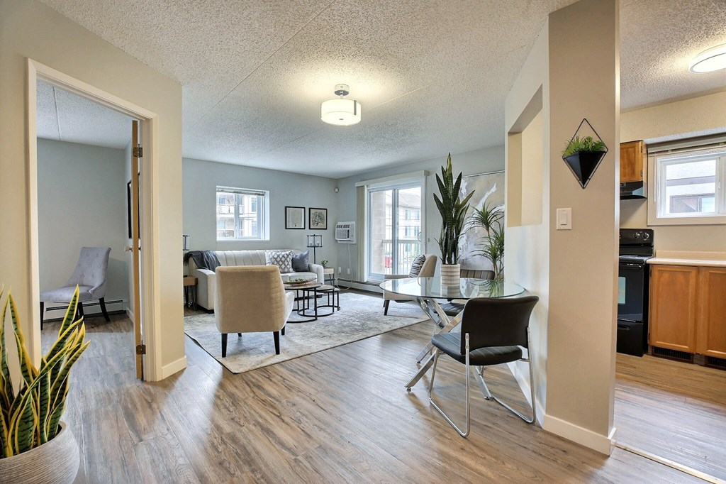 an open living room and dining room with a table and chairs