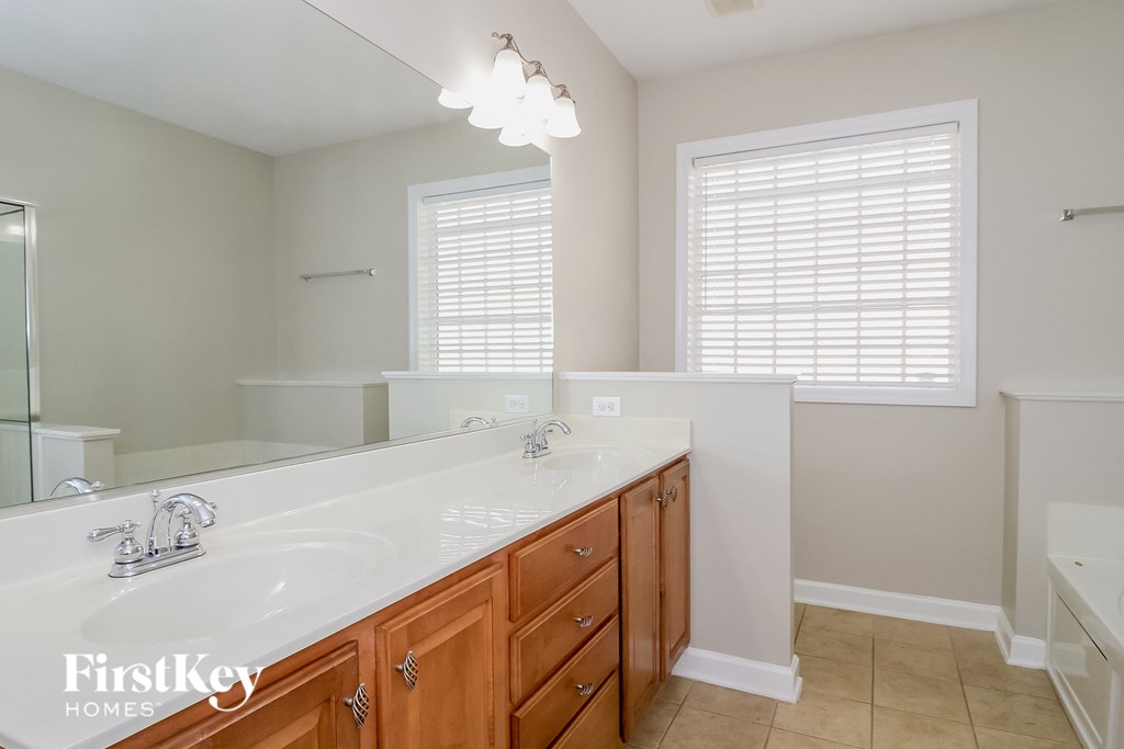 a bathroom with a large sink and a large mirror