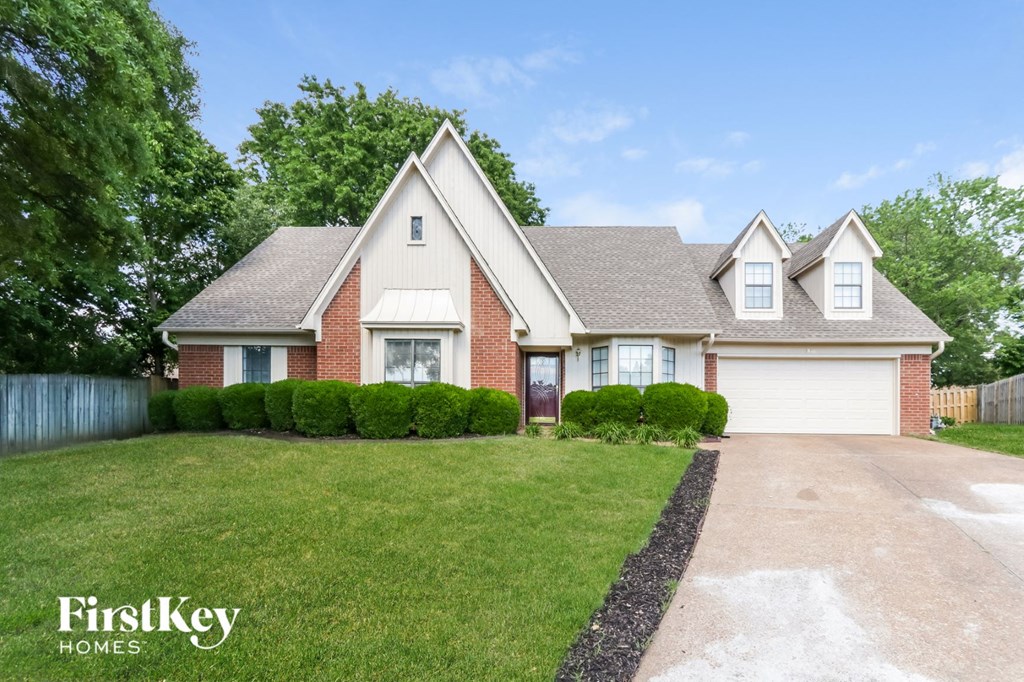 A house with a driveway in front of it.
