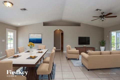 A virtual staged image of a modern dining room with a large table and chairs.