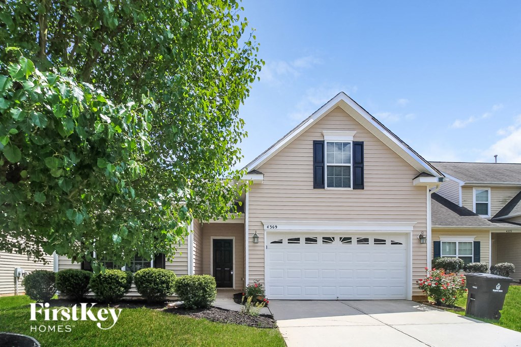 a suburban house with a white garage door