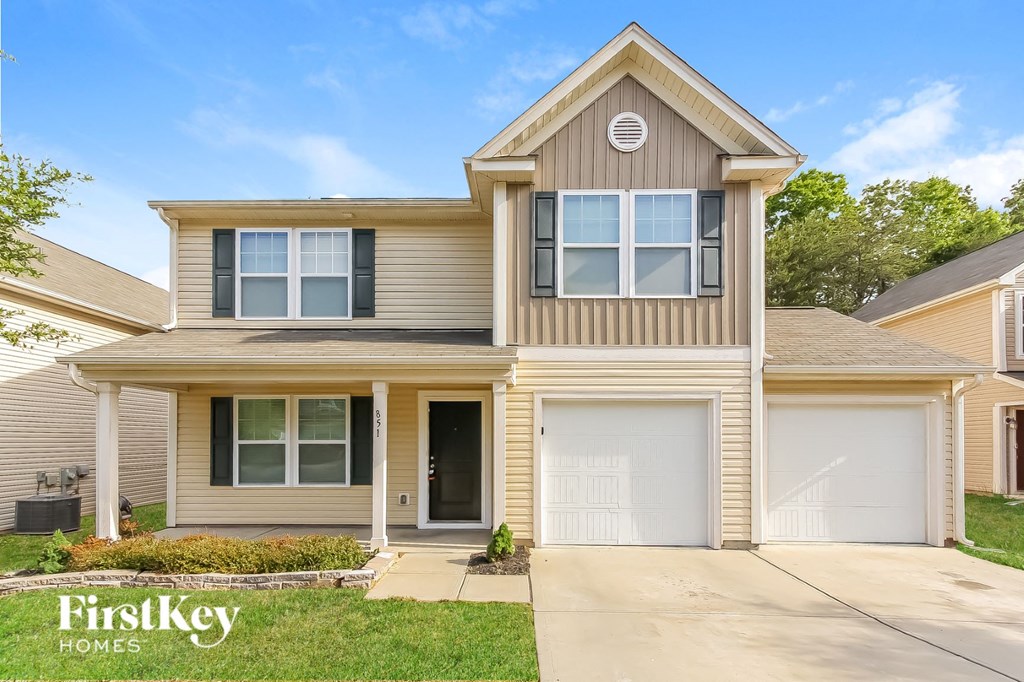 A two-story house with a garage is for sale by FirstKey Homes.