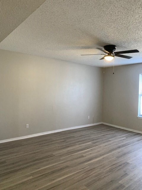 A room with a ceiling fan and light fixture.