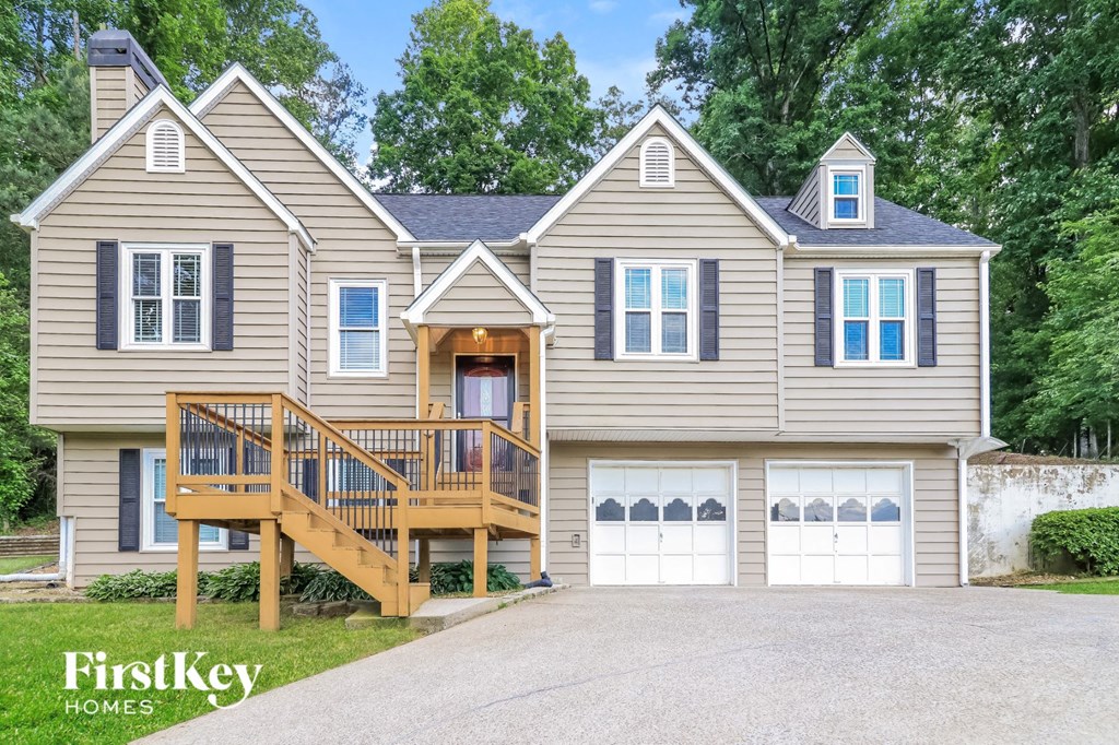 a home with a deck on the side of a house