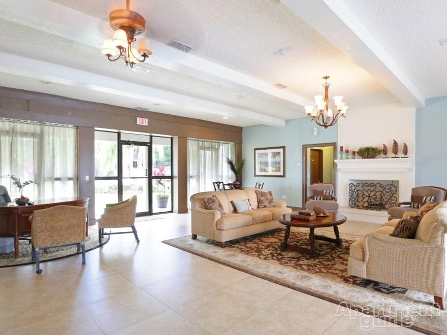 A living room with a fireplace and a couch.