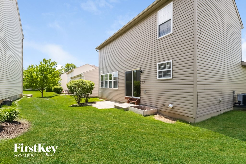 A house with a lawn in front of it.