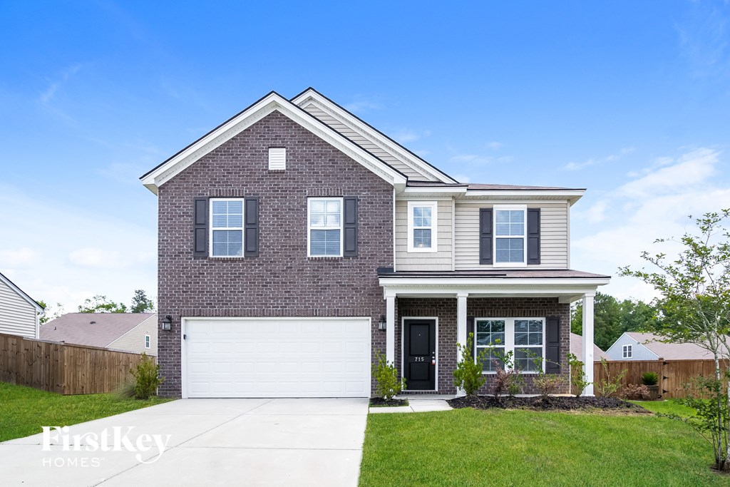 a brick house with a white garage door