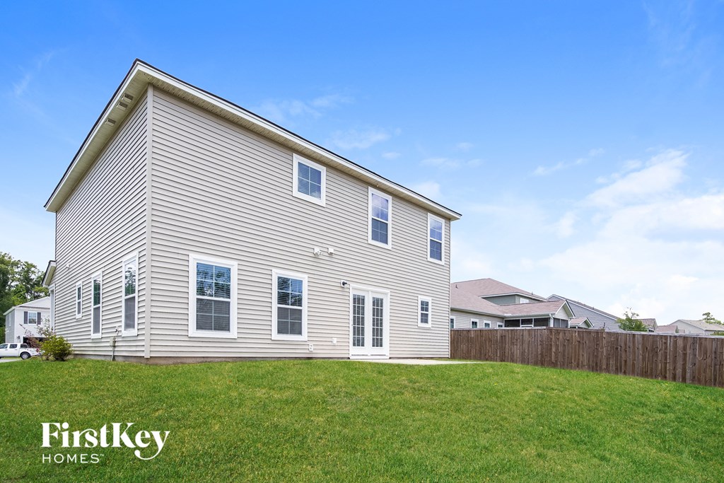 a house with a fisheye view of a yard and a fence