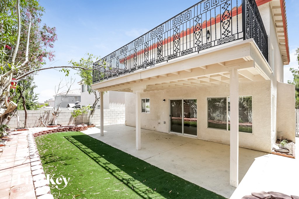 a house with a patio and a balcony