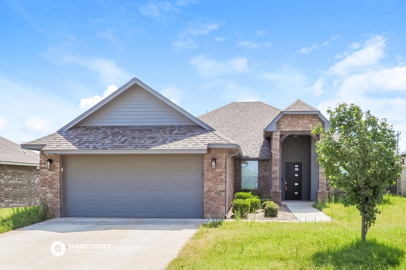 the front of a house with a garage door