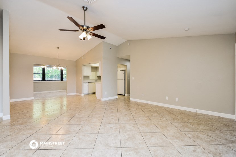 the spacious living room and dining room are open to the kitchen and family room