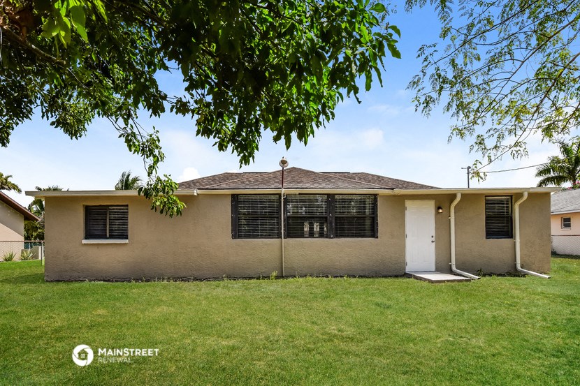 a house with a yard and a tree