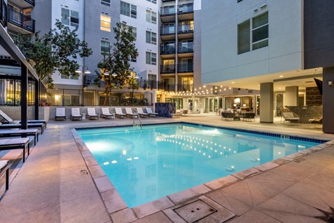 a swimming pool in the middle of an apartment building