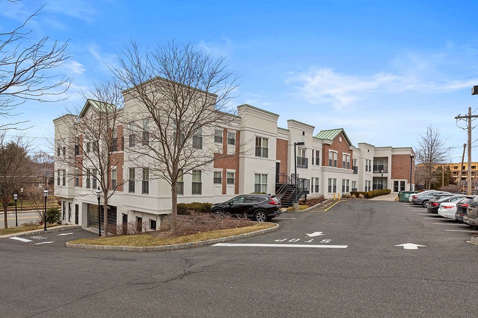 a row of apartment buildings on a city street