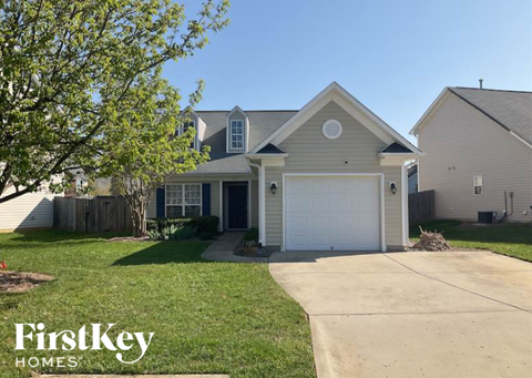 A house with a garage is for sale by FirstKey Homes.