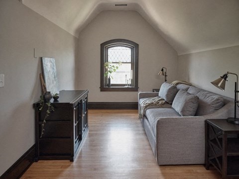 a living room with a couch and a window