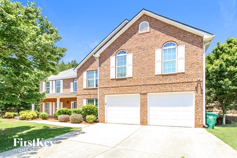 a brick house with a white garage door