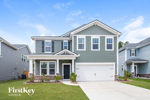 a blue house with a white garage door
