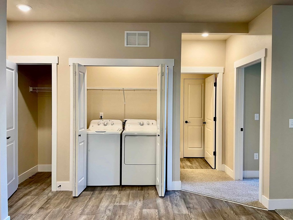 A laundry room with a washer and dryer in it.