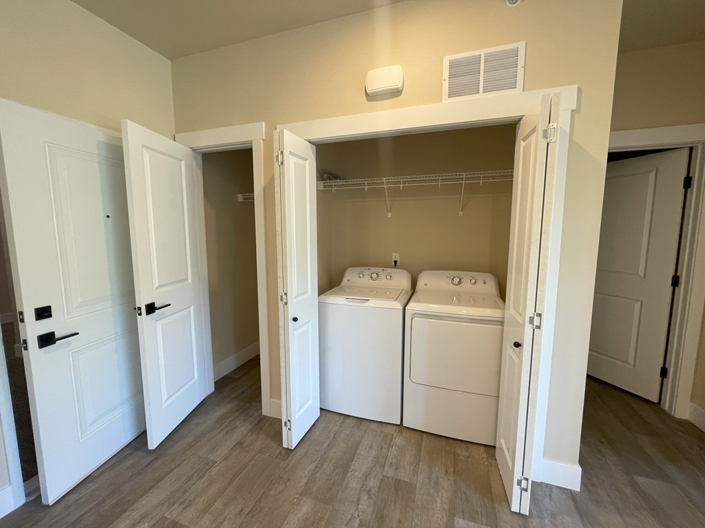 A laundry room with a washer and dryer in it.