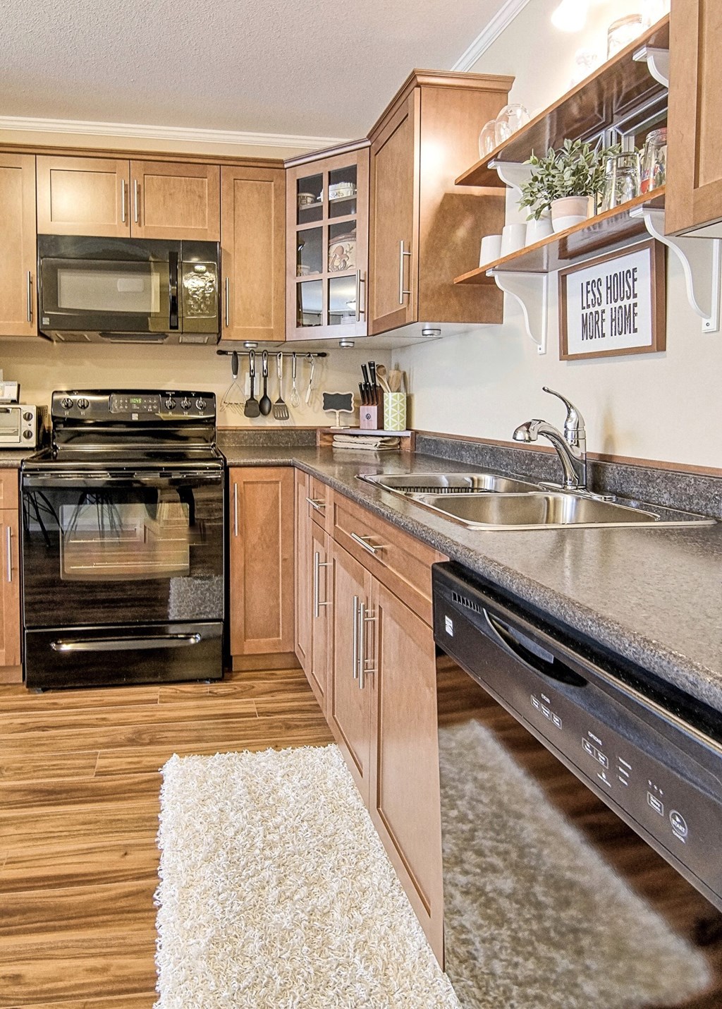 a kitchen with stainless steel appliances and wooden cabinets