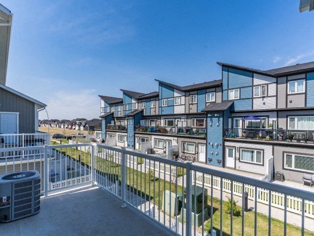 the view from the balcony of a building overlooking the beach