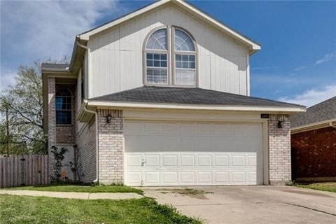 A two-car garage is attached to a house.