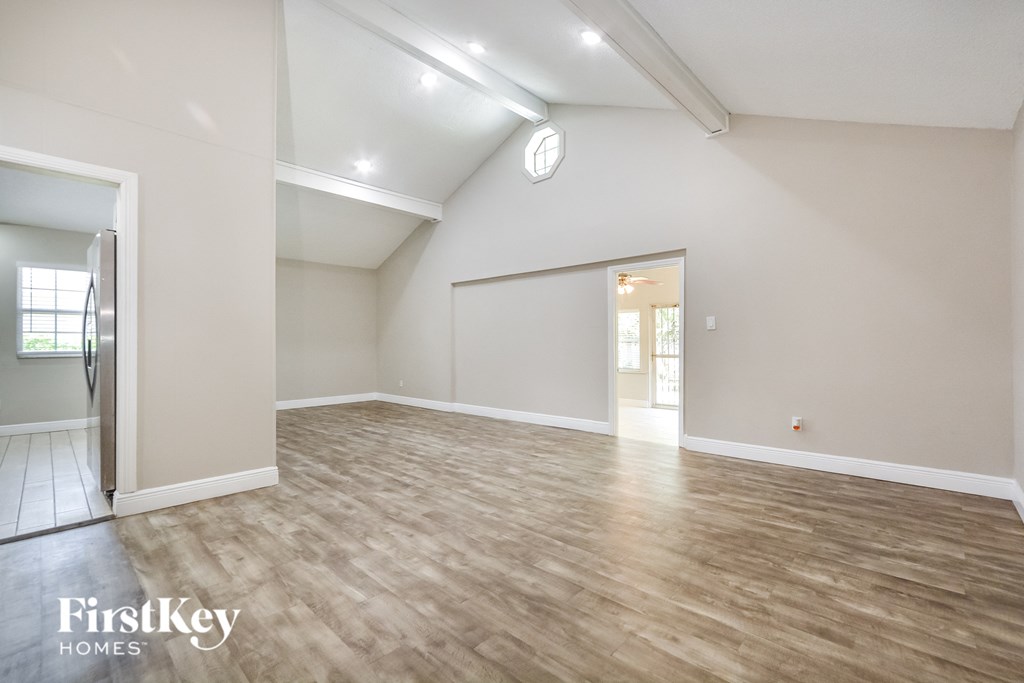 the living room is spacious and ready to be used as a family room