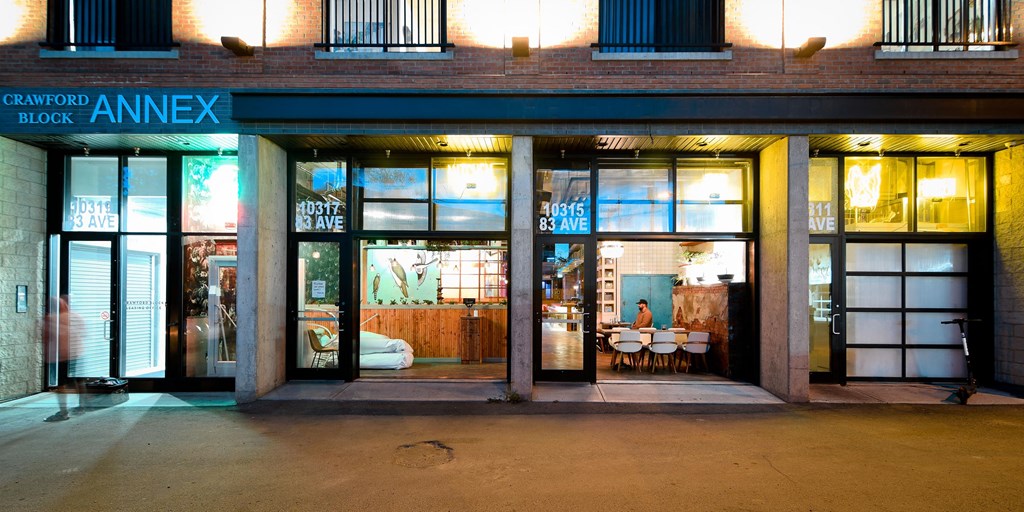 a restaurant with large glass doors and a table in the window