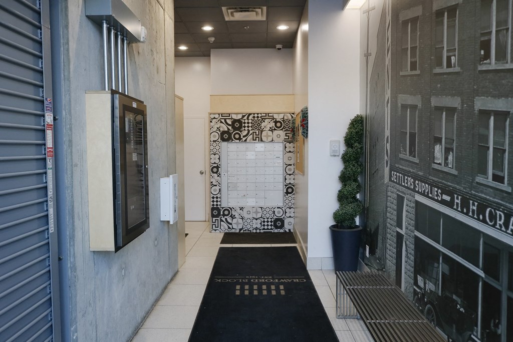 the entrance to the lobby of a building with a black and white door