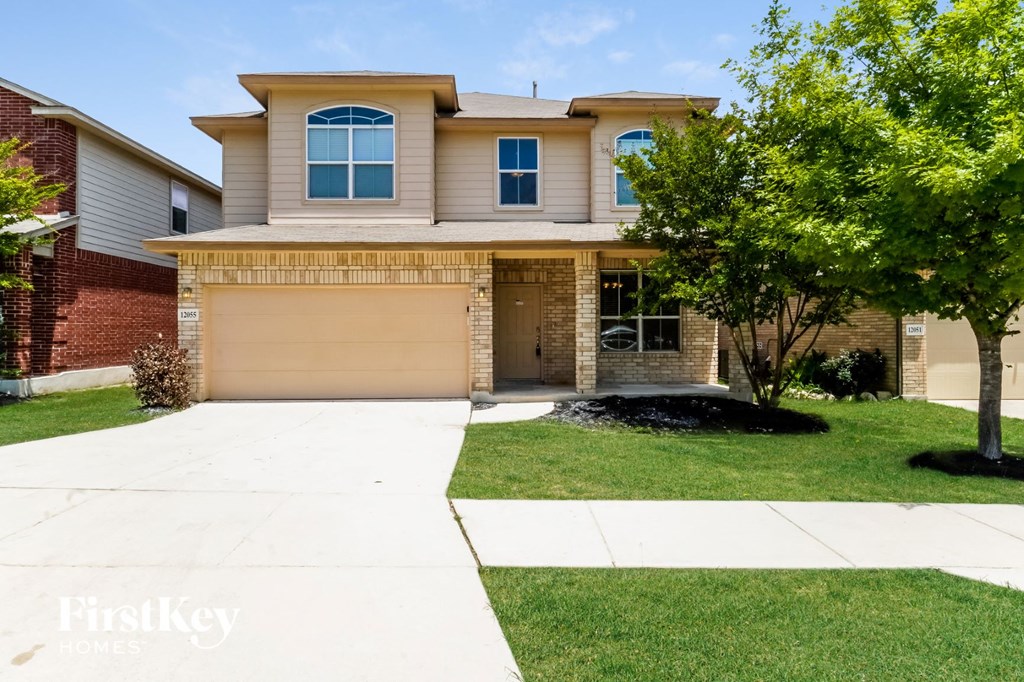 a house with a garage and a lawn