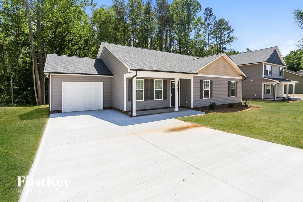 a house with a driveway and a garage door