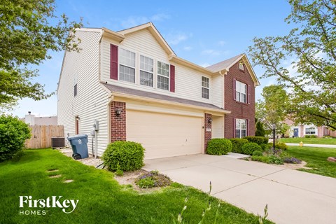 A two-story house with a garage is for sale by FirstKey Homes.